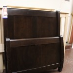 Archbold Twin Sleigh Bed finished in Rustic Brown